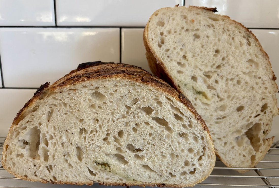 Fresh-baked garlic rosemary sourdough loaves